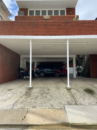 Covered car space in 6 unit owner occupied building with 24 hour access backing onto safe alley.